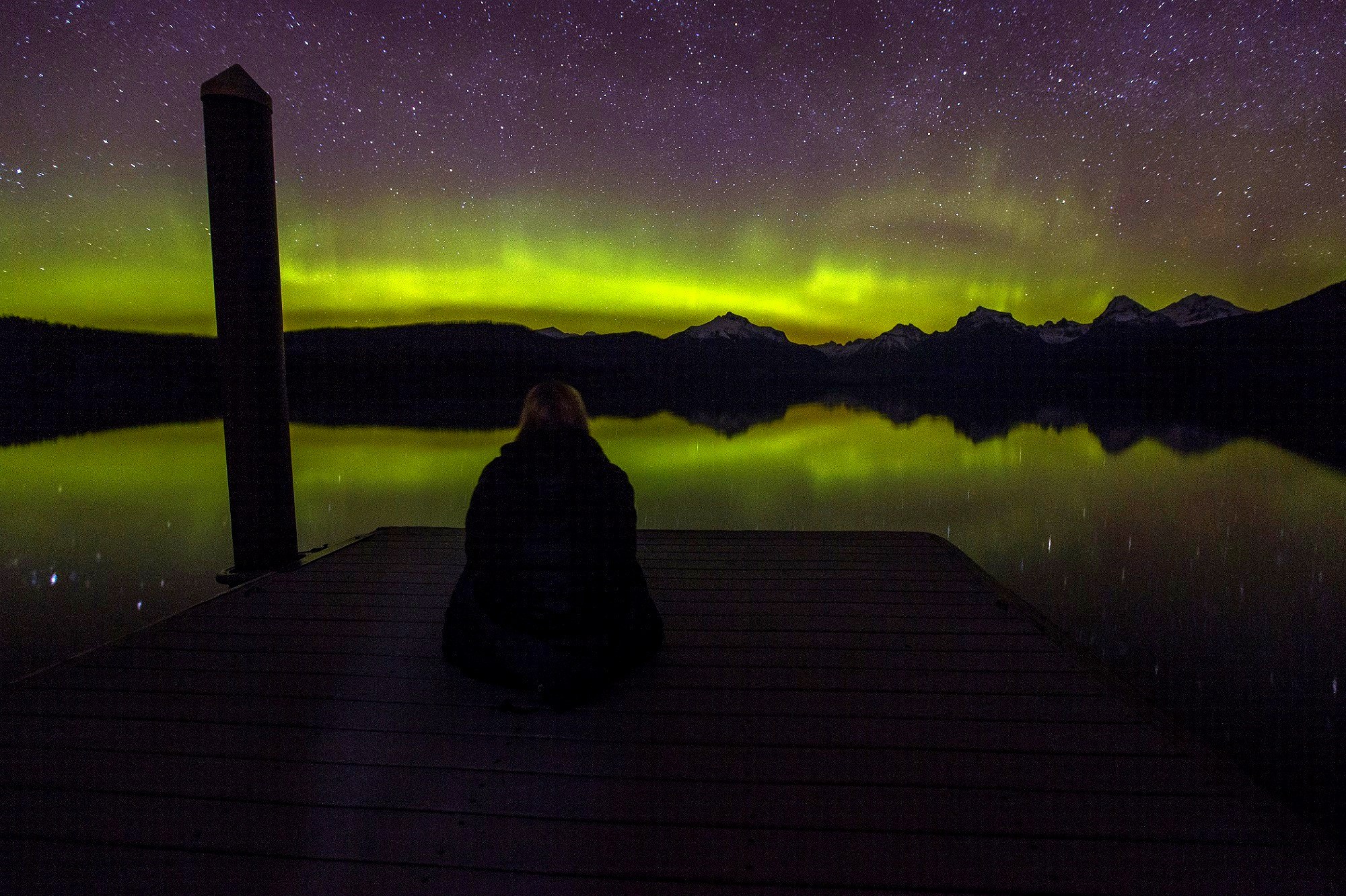 Aurora borealis over a mountain lake