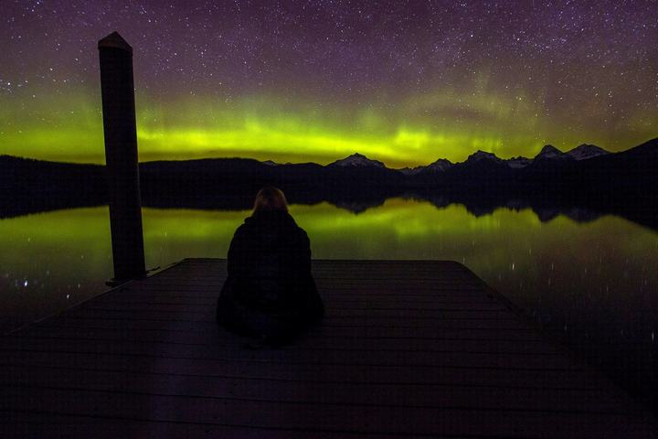 Aurora borealis over a mountain lake